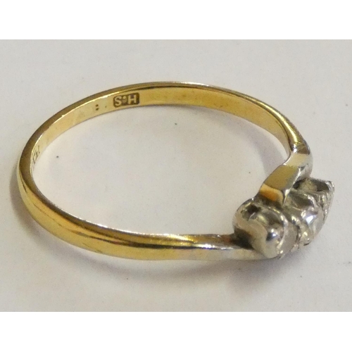 127 - An 18ct gold three stone diamond ring, approximately 0.20cts, weight 2.7gms, size P1/2