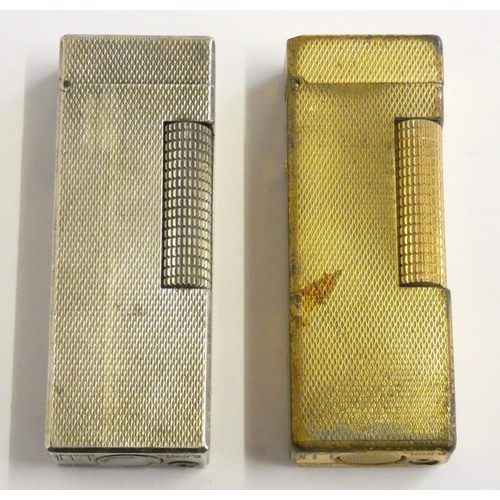 144 - A Dunhill 70 cigarette lighter, case, paperwork, another cased Dunhill lighter and a third, uncased.