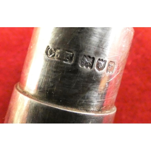 146 - A sterling silver pair of desk candlesticks, loaded, an Edwardian silver trinket box, Birmingham 190... 