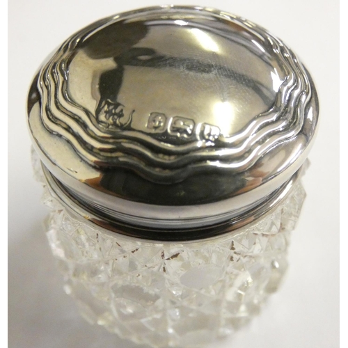 148 - An oval silver photograph frame, Sheffield 1985 and two silver mounted pieces (3).