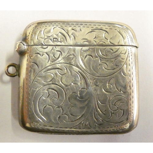 152 - A Victorian silver pair of salt pots, Birmingham 1894, with glass liners and spoons, a silver vesta ... 