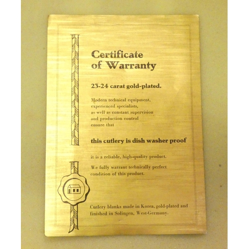 163 - A Solingen, West Germany gold plated canteen of cutlery for twelve place settings, apparently unused... 