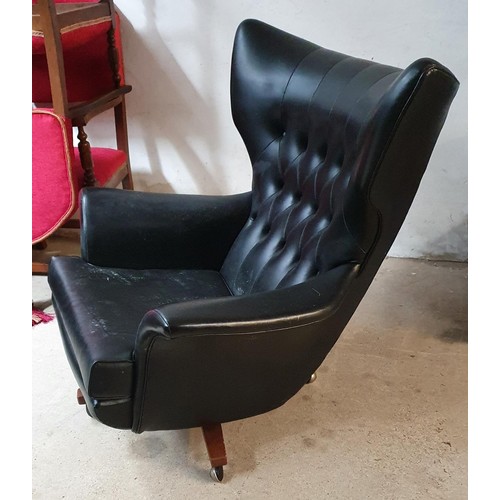 494 - A G Plan Rexine wingback swivel and rocking armchair and stool, model 6250, 92 cm wide x 101 cm high... 