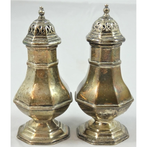 66 - A Victorian pair of server pepper pots, by E.K.R., untraced, London 1882, of octagonal baluster form... 