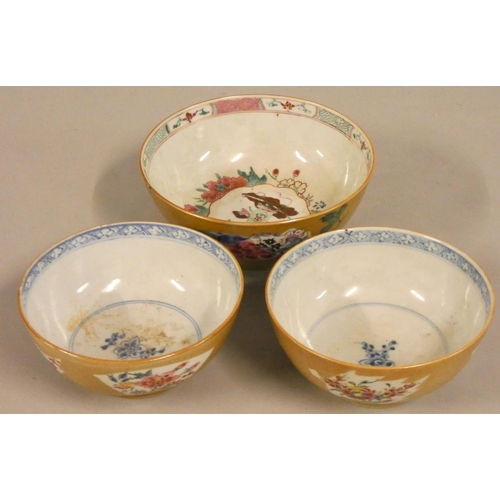 362 - A pair of Chinese Qing dynasty porcelain bowls, with blue borders, the brown glaze exterior with pan... 