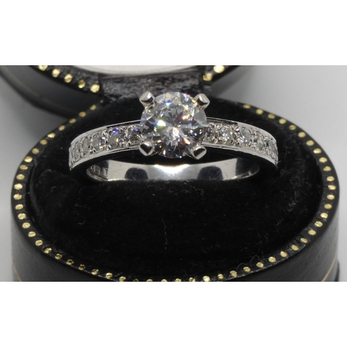 96 - A platinum and diamond single stone ring, claw set with a brilliant cut stone, weighing 1.005cts, co... 