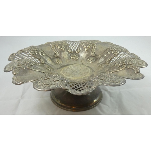 65 - A Victorian silver pedestal basket, Sheffield 1901, with pierced, embossed and lobed basket raised o... 