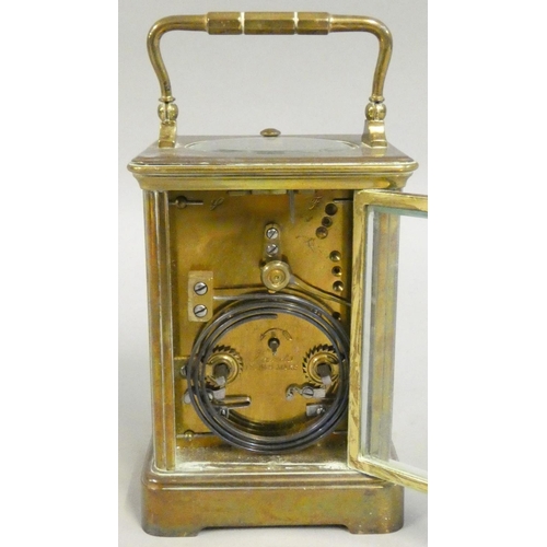 420 - A French brass striking carriage clock, the white enamel dial with Roman numerals and retailer signe... 