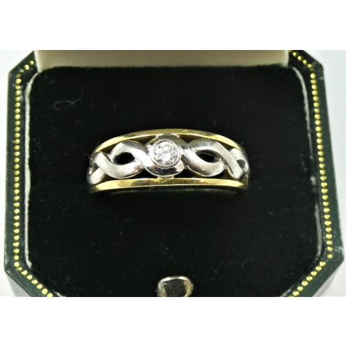 86 - An 18ct yellow and white gold and diamond single stone ring, collet set with a brilliant cut stone, ... 