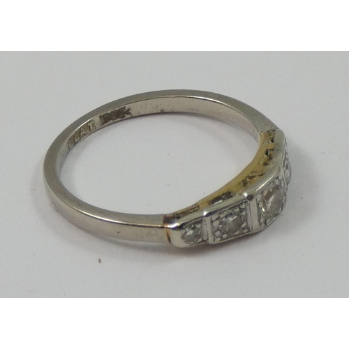 90 - A platinum, 18ct white gold and diamond ring, set with an old cut brilliant flanked by single cuts, ... 