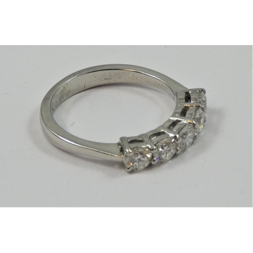 112 - A platinum and diamond five stone ring, claw set with uniform brilliant cut stones, total weight app... 