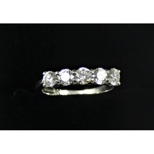 112 - A platinum and diamond five stone ring, claw set with uniform brilliant cut stones, total weight app... 