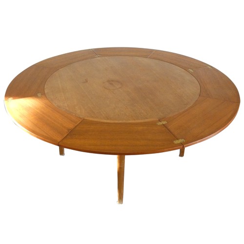 496 - A Danish teak Flip Flap or Lotus Leaf circular extending dining table, manufactured by Dryland - Smi... 
