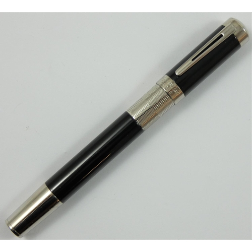 76 - A Waterman Elegance rollerball pen, model S0891410, with black lacquer body and silver plated mounts... 