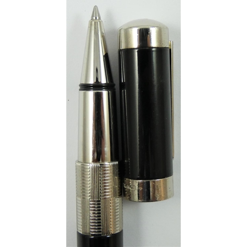 76 - A Waterman Elegance rollerball pen, model S0891410, with black lacquer body and silver plated mounts... 