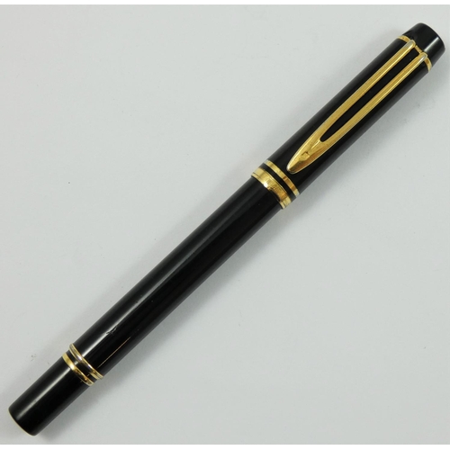 77 - A Waterman 100 rollerball pen, with black lacquer body and gilt mounts.