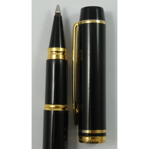 77 - A Waterman 100 rollerball pen, with black lacquer body and gilt mounts.