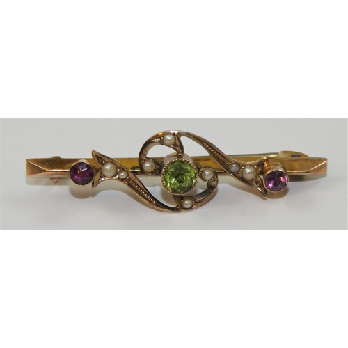 98 - An Edwardian 9ct rose gold Suffragette Brooch, Chester 1911, the milligrain collet set peridot flank... 