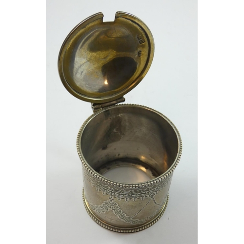 68 - A Victorian silver mustard pot, London 1868, of circular form with bright cut engraved decoration, r... 