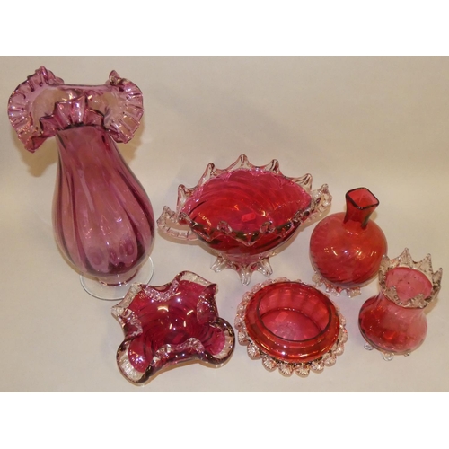 303 - six Victorian Cranberry glassware, to include a twin handled bowl, two other bowls and two vases (6)... 