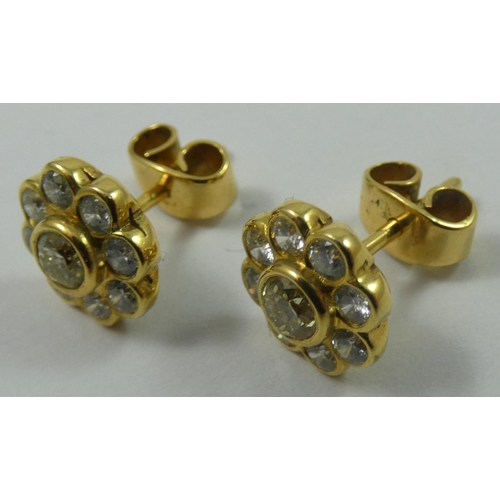 114 - A pair of yellow gold , fancy yellow and white diamond cluster earstuds, the central stone of good c... 