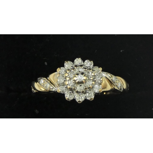 94 - A white gold diamond cluster ring, claw set brilliant cut stones.