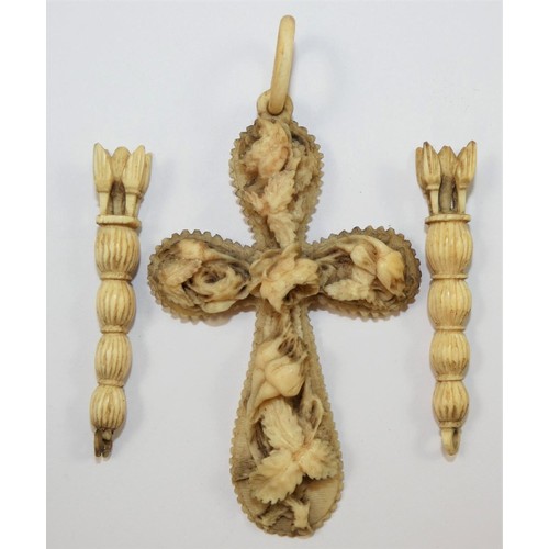 116A - A Victorian carved ivory cross, decorated with roses, length 9 cm, together with a pair of carved iv... 