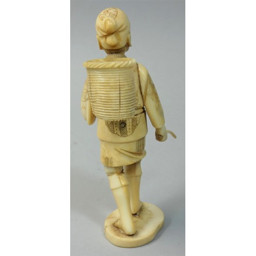 351 - A Japanese sectional Ivory Okimono, carved to depict a man with a basket, unsigned, height 13 cm, an... 