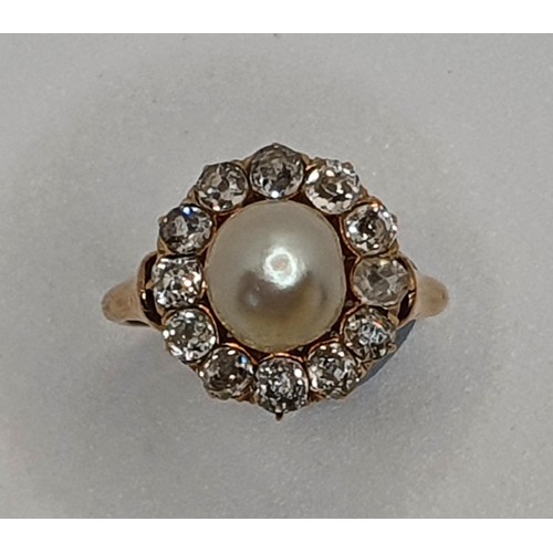 101 - A Victorian natural pearl and diamond cluster ring, the peg set natural saltwater bead, measuring 7.... 