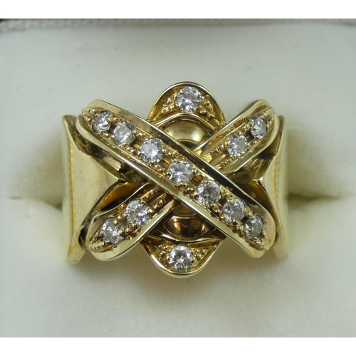 102 - A gold and diamond dress ring, the cross motif set with 13 brilliant cut stones, weight approximatel... 