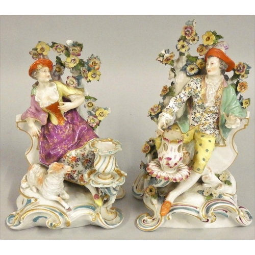 343 - A pair of late 19th century continental figural candlesticks, possibly Sitzendorf, unmarked, depicti... 