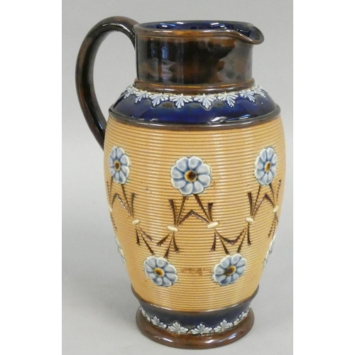 325 - A Doulton Lambeth stoneware jug, with impressed floral decoration, impressed marks, 21 cm.