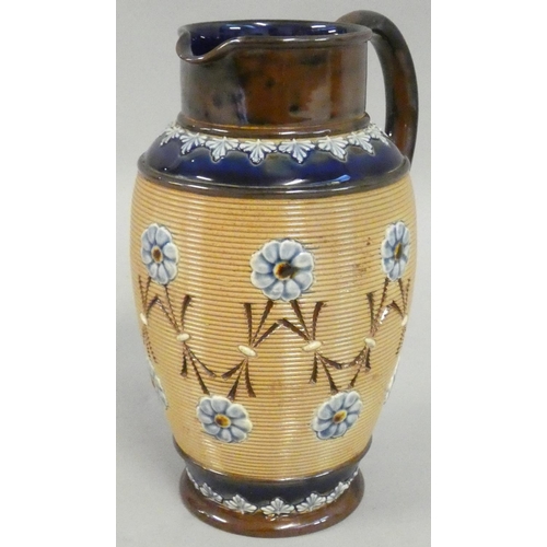 325 - A Doulton Lambeth stoneware jug, with impressed floral decoration, impressed marks, 21 cm.