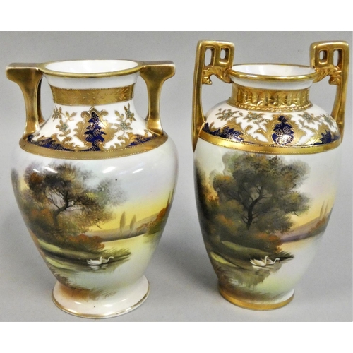 357 - A pair of Japanese Noritaki baluster vases, decorated with swans on a lake, gilt handles, 20 cm.