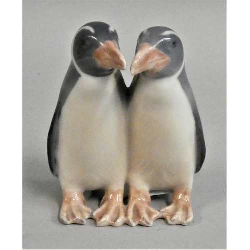 333 - A Royal Copenhagen porcelain model of a pair of penguins, design number 1190, 9.5 cm.