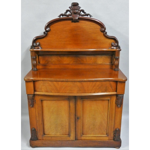 474 - A Victorian mahogany chiffonier, the shaped back with shelf, over a serpentine frieze drawer, over t... 