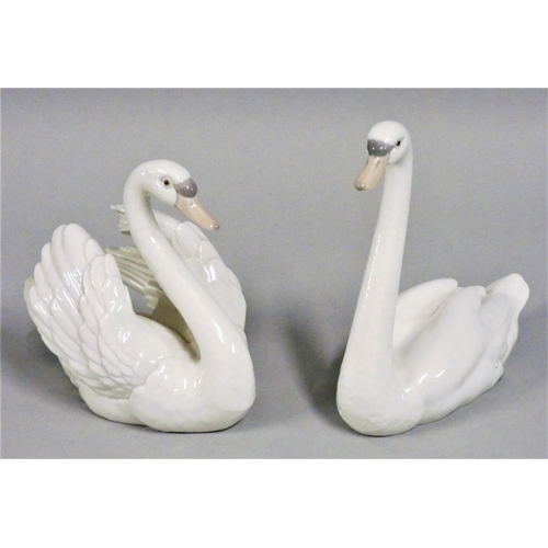 319 - A pair of Lladro figures of swans, one with outstretched wings, impressed marks 'B-2E' and 'B-20D', ... 