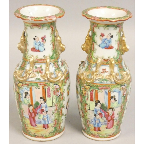 373 - A pair of 19th century Chinese famile verte vases, decorated with figures and birds, with gilt drago... 