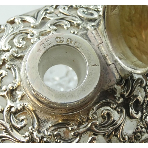 41 - A Victorian cut glass and silver mounted scent bottle, Birmingham 1897, the hinged cover to a pierce... 