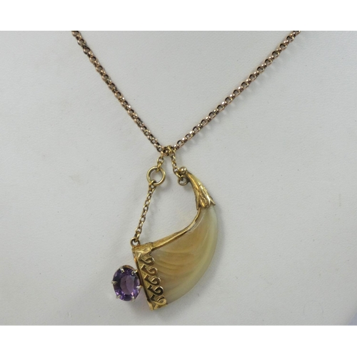 120 - A Victorian gold mounted tigers claw and amethyst pendant, belcher link chain