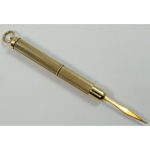 131 - A 9ct gold toothpick, Birmingham 1989, with engine turned decoration, 6.5 gm.