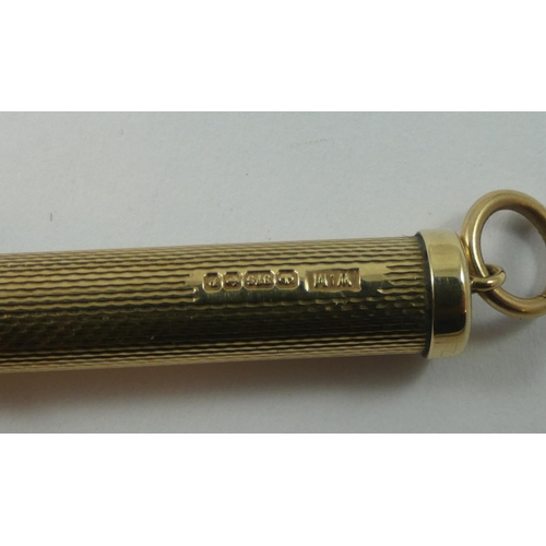 131 - A 9ct gold toothpick, Birmingham 1989, with engine turned decoration, 6.5 gm.