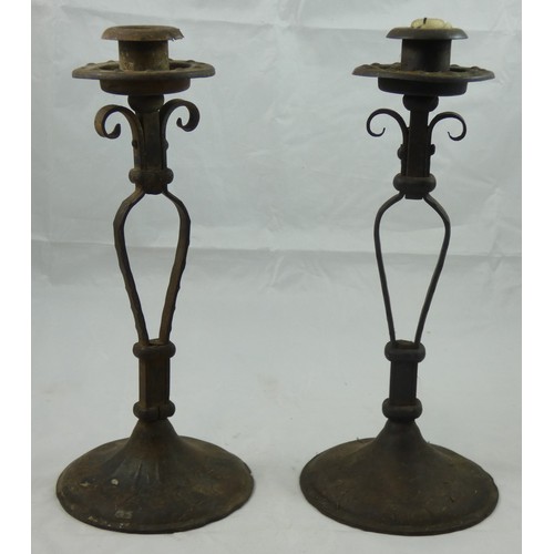 204 - A pair of Arts & Craft copper and brass candlesticks, possibly by W.A.S. Benson, raised on circular ... 