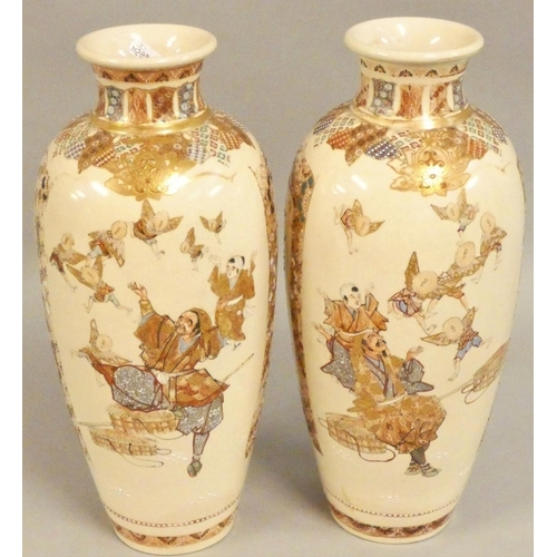 359 - A Japanese large pair of Satsuma Meiji period vases, decorated with two dignitaries to one panel and... 