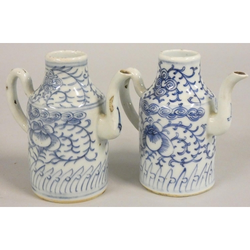 381 - A pair of 19th century blue and white pottery ewers, height 13 cm.