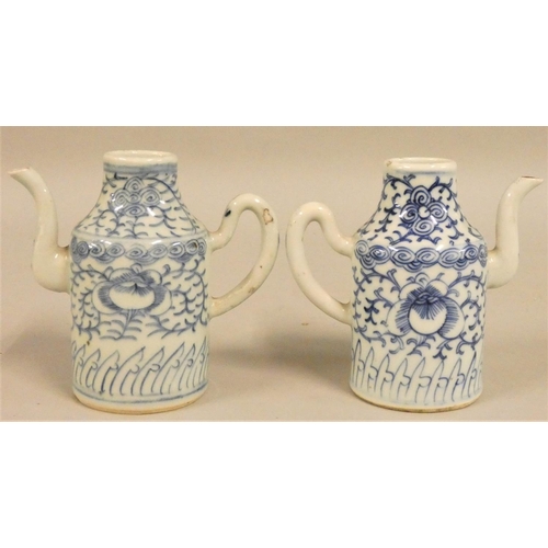 381 - A pair of 19th century blue and white pottery ewers, height 13 cm.