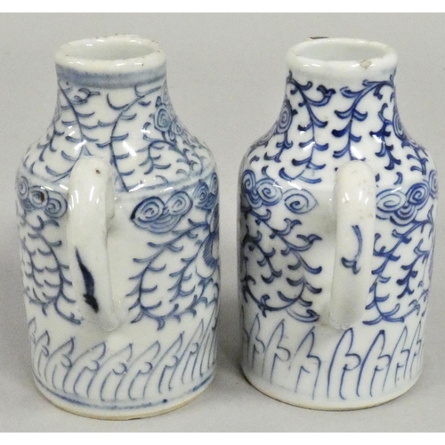 381 - A pair of 19th century blue and white pottery ewers, height 13 cm.