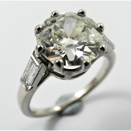 107 - An Art Deco French platinum single stone diamond ring, claw set with an old brilliant cut stone, cal... 