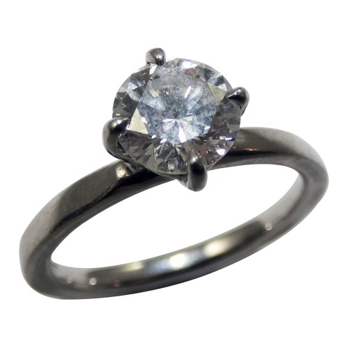 127 - A platinum and diamond single stone diamond ring, four claw set with a brilliant cut stone weighing ... 