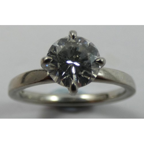 127 - A platinum and diamond single stone diamond ring, four claw set with a brilliant cut stone weighing ... 